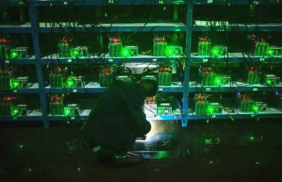 Mining farm with rows of mining rigs