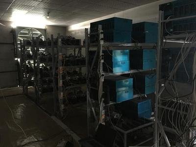 An overview of a modern mining rig setup in a professional hosting farm, emphasizing efficiency and scalability